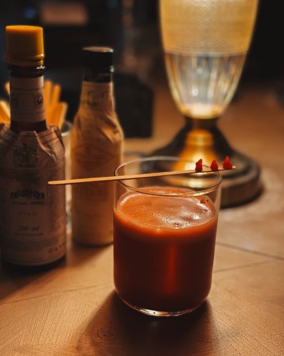 Craft cocktail with bitters at the OIKOS bar