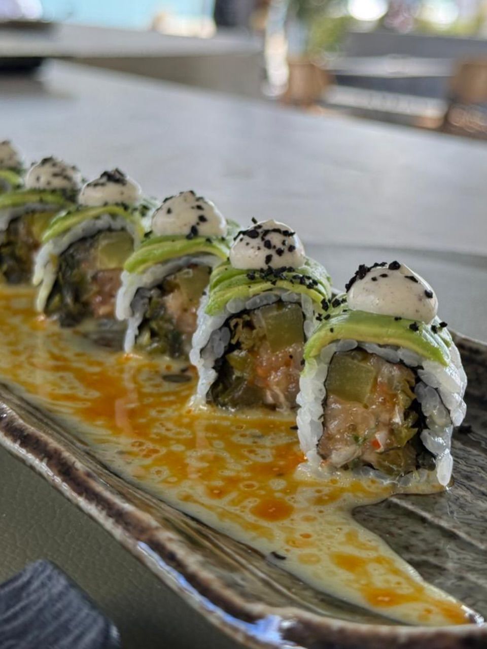 Hamachi jalapeño sushi at OIKOS