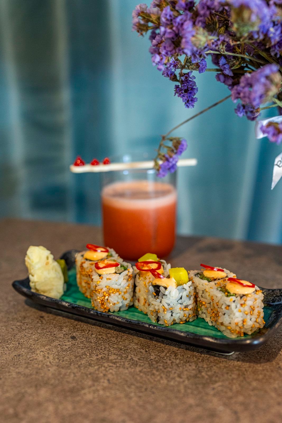 Sushi rolls with a cocktail at OIKOS